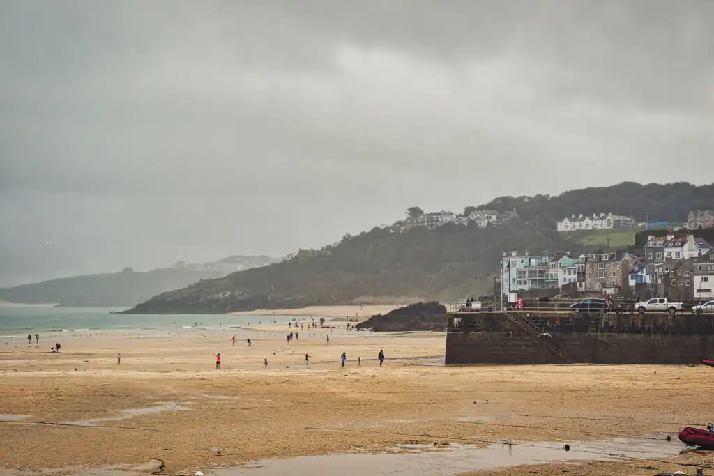 Coastal Beach Scene Under Cloudy Sky in St Ives, Cornwall, UK